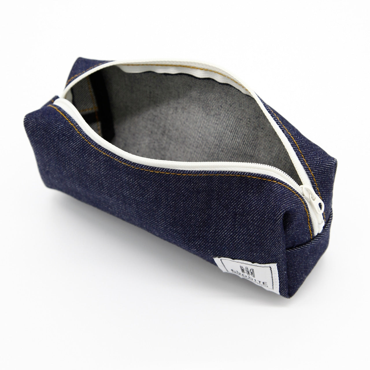 Navy blue denim pouch with white zipper on a white background