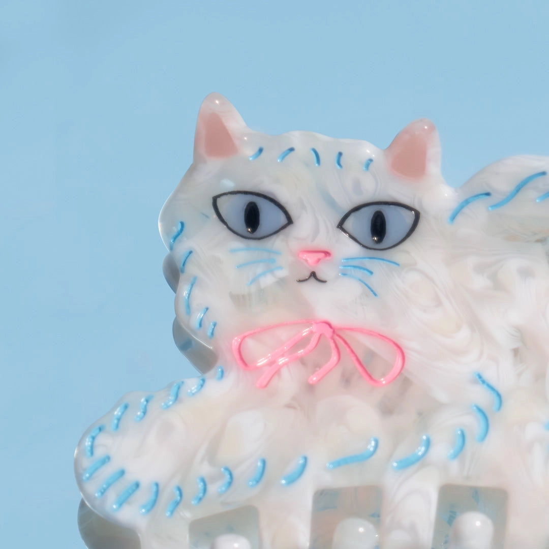 White Persian Cat Hair Claw with Pink Bow · Winona Irene