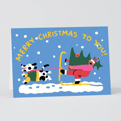 Merry Christmas Skiing Embossed Holiday Card · Wrap